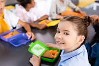 Schoolgirl with lunch box