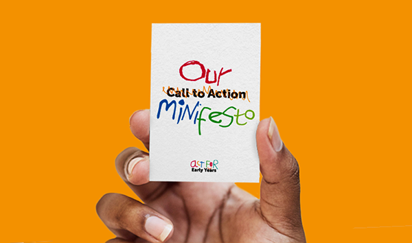 A hand holds up our 'Minifesto'