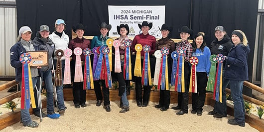western riding team with ribbons