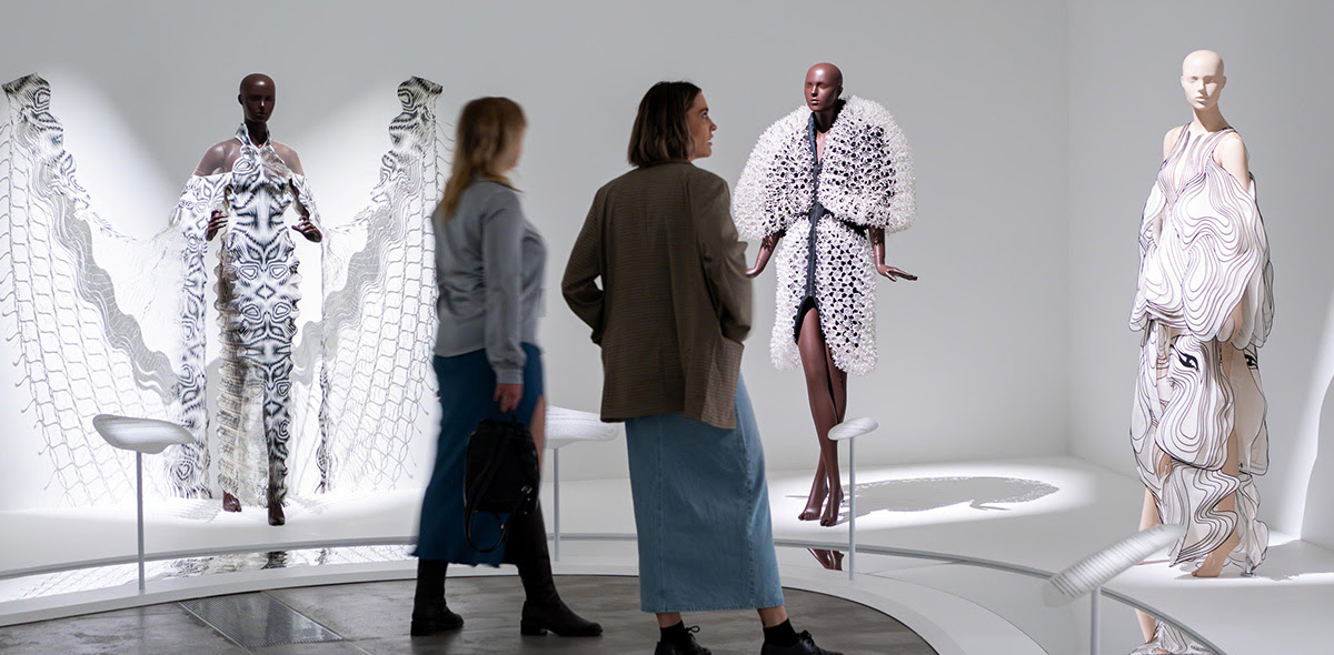 Two ladies viewing the Iris Van Herpen Exhibition