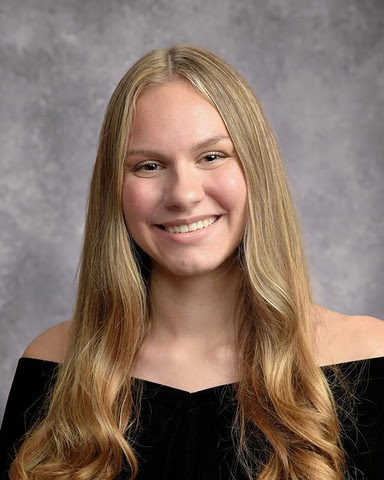 a senior style photo of Maggie Shunnarah, she is wearing a black dress