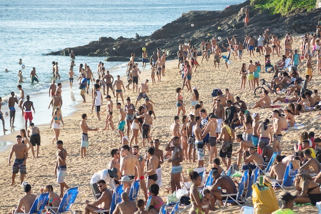 Many people flock to the beach at porto da barra in salvador