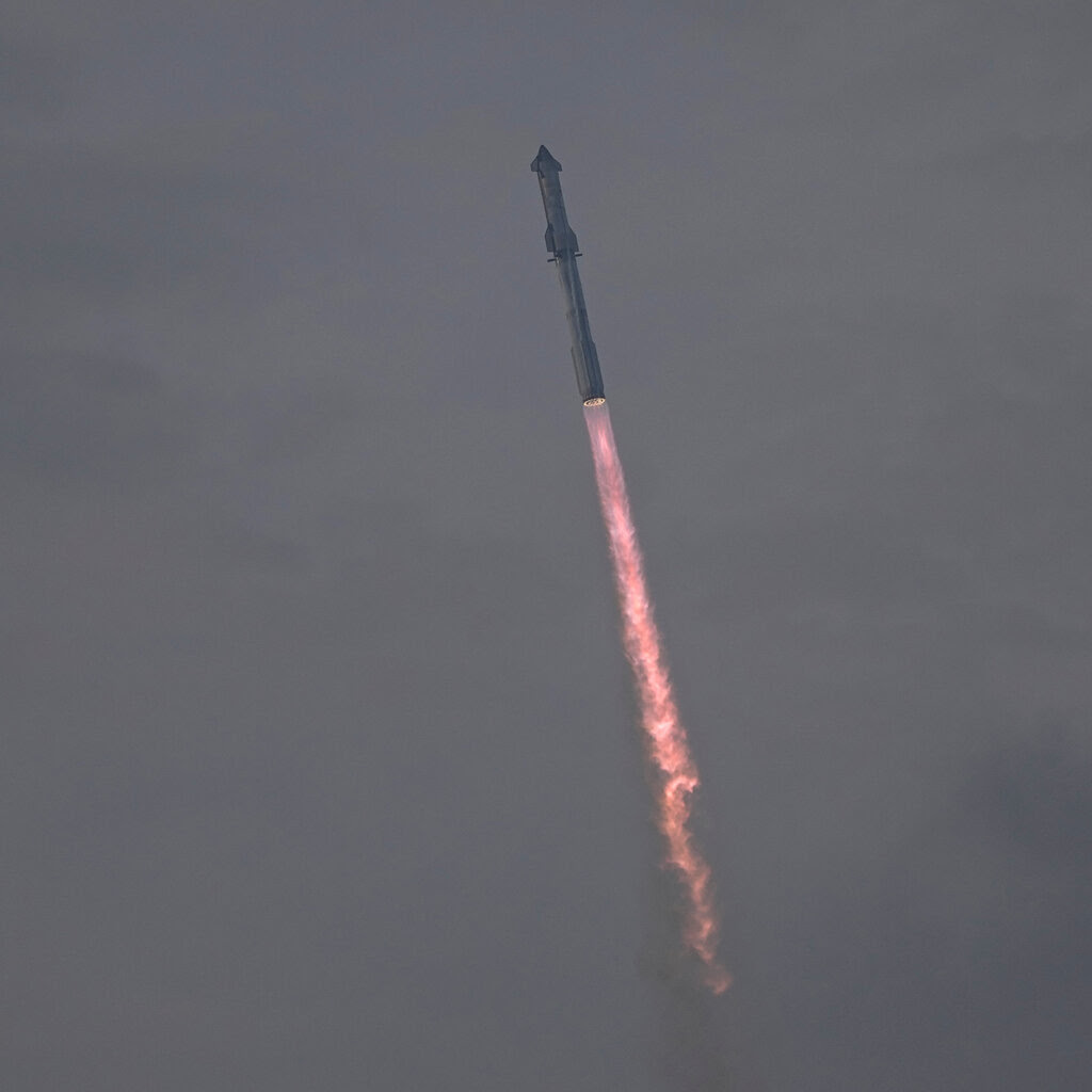 A rocket launches into the sky 