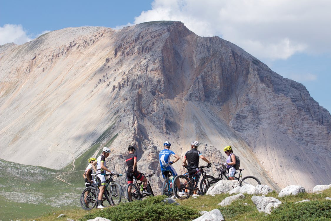 Free Group of Mountain Bikers Parked near the Mountains Stock Photo