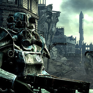 In a video game screenshot, a heavily armored character with a gun stands in ruined streets near the Washington Monument, which is partially destroyed.