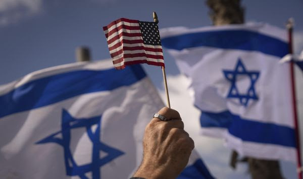 Israelis opposed to a contentious government plan to overhaul the judiciary wave Israeli and American flags during a protest in support of President Joe Biden, who criticized the plan this week, outside of the U.S. Embassy Branch Office in Tel Aviv, Israel, March 30, 2023. As Biden prepares to meet Israeli Prime Minister Benjamin Netanyahu this week in New York, a new poll finds that while Americans generally view Israel as a partner or ally, many question whether his far-right government shares American values. (AP Photo/Oded Balilty, File)