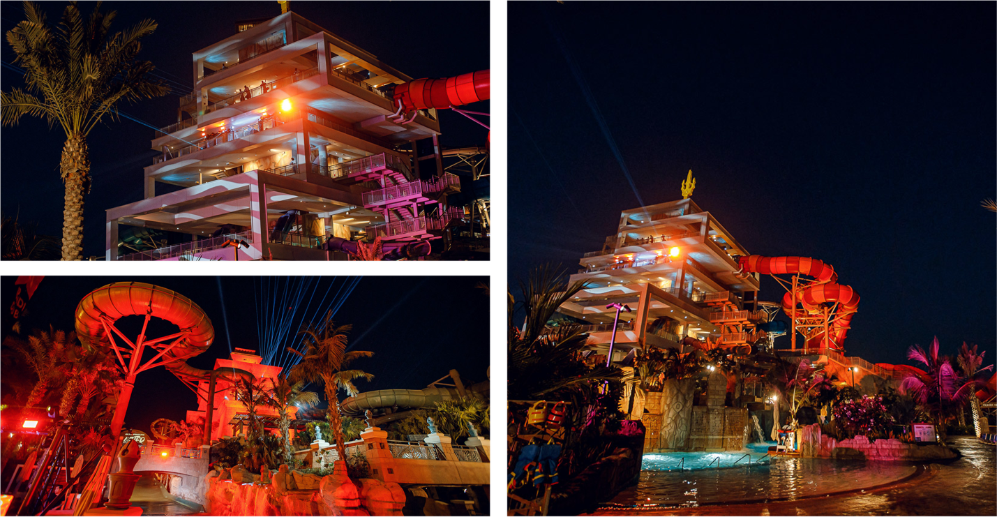 A multi-story building with a slide and a pool at nightAI-generated content may be incorrect.