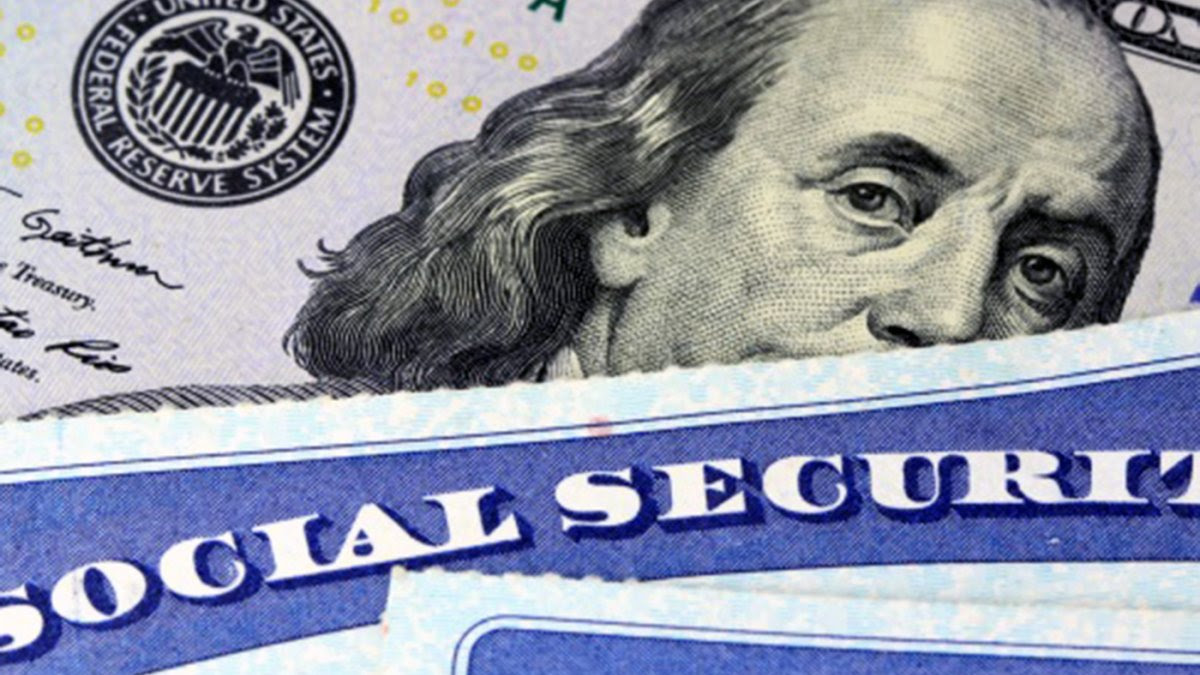 Ben Franklin on $100 bill layered with Social Security Card