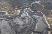 Aerial view of the empty reservoirs that once held water behind major dams on the Klamath River.