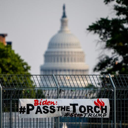 WASHINGTON, DC - JULY 08: A sign that reads "Biden: #PassTheTorch, #StopTrump" is posted on the gate of an overpass with the dome of the U.S. Capitol Building visible in the background on July 8, 2024 in Washington, DC. Concerns about Biden's age and perceived slowing down have intensified, with critics fearing these issues could undermine his ability to effectively challenge Trump in the upcoming election. Andrew Harnik/Getty Images/AFP (Photo by Andrew Harnik / GETTY IMAGES NORTH AMERICA / Getty Images via AFP)