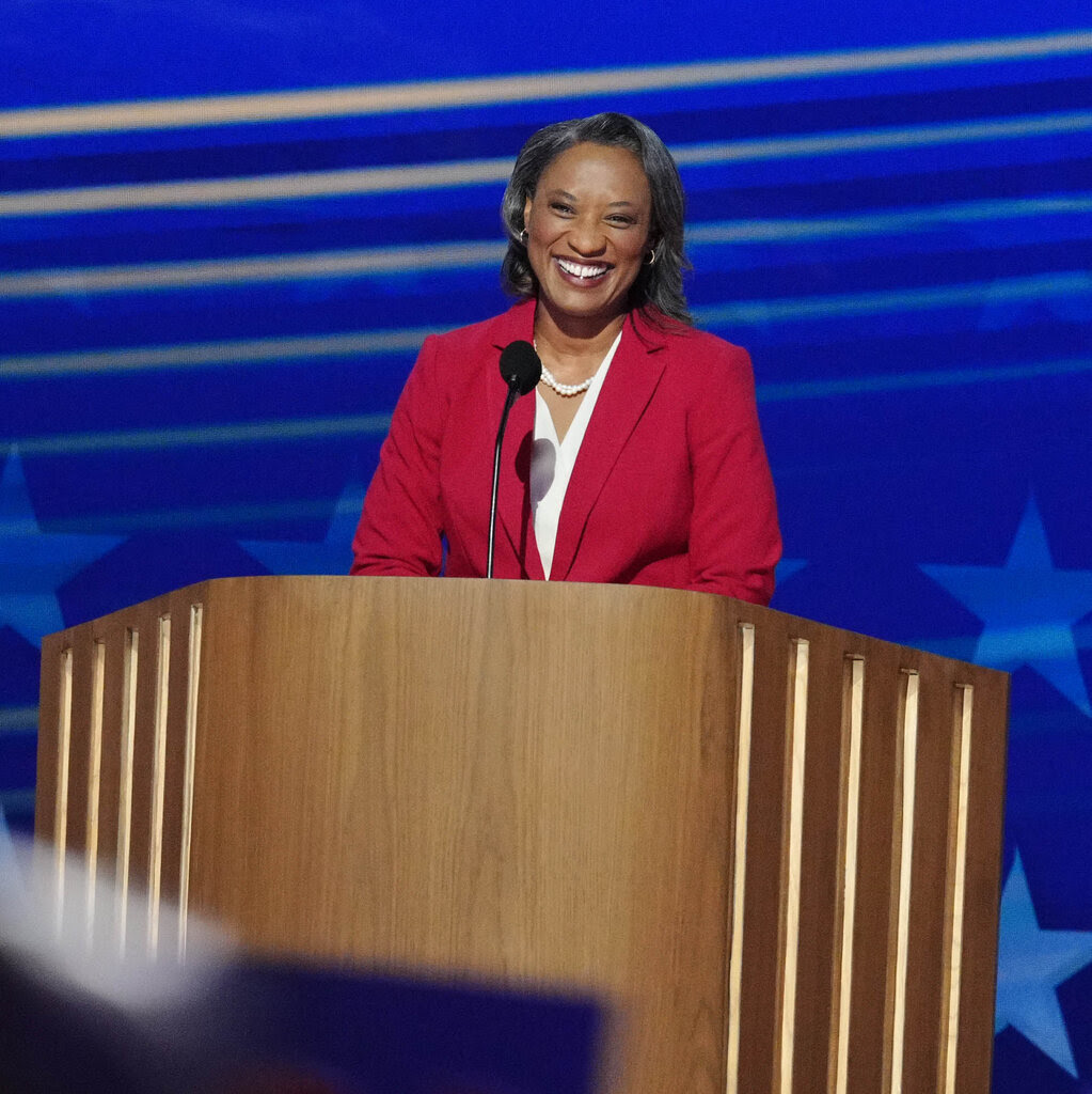 Former Senator Laphonza Butler of California stands behind a lectern at the Democratic National Convention.