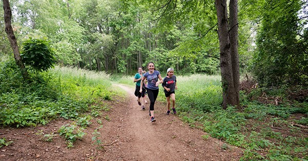 Kids running on a trail at Waterloo