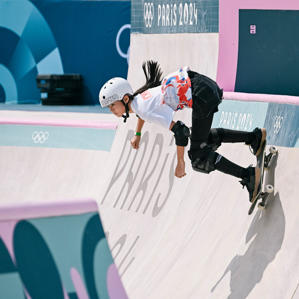 A skateboarder wearing a helmet in training at the Paris Games. 