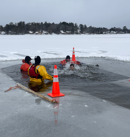 Rangers in the water at Polar Freeze for a Cure event monitoring participants