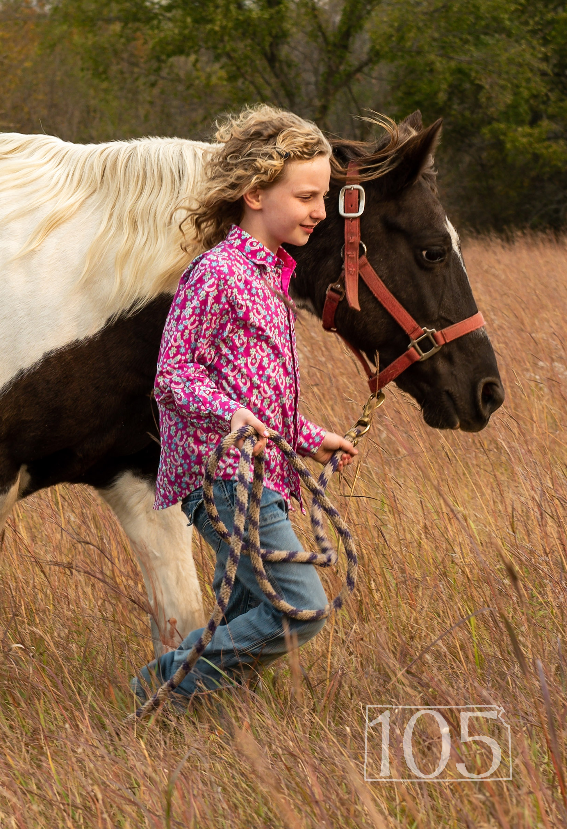 girl leading horse