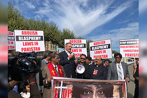 A crowd is gathered in protest against blasphemy laws in Pakistan.