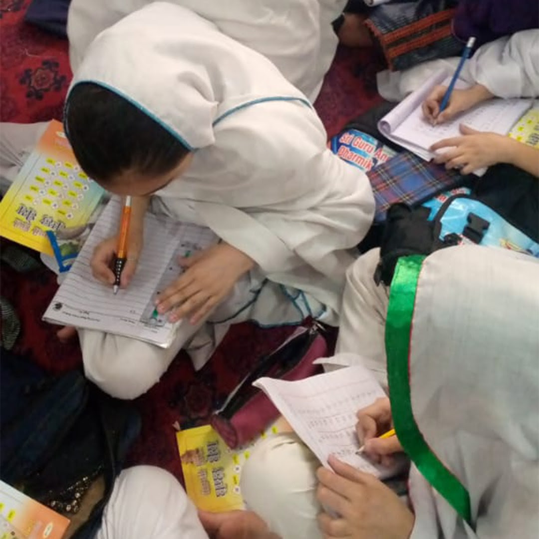 Young students in Peshawar, Pakistan, engaged in Gurmat and Panjabi classes