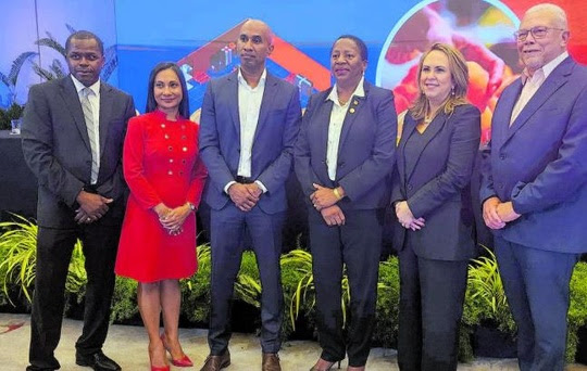 IDB country representative in T&T, Julian Belgrave, Massy Integrated Retail Portfolio CEO, Ambikah Mongroo, deputy group CEO of Massy, James McLetchie, Planning Minister Pennelope Beckles, managing director and chief investment officer of IDB Invest, Marisela Alvarenga and Massy Holdings chairman Robert Riley gather for a group photograph at Monday’s signing ceremony at the Hyatt Regency for the US$150 million funding that IDB Invest made available to the Massy Group. PHOTO BY PETER CHRISTOPHER