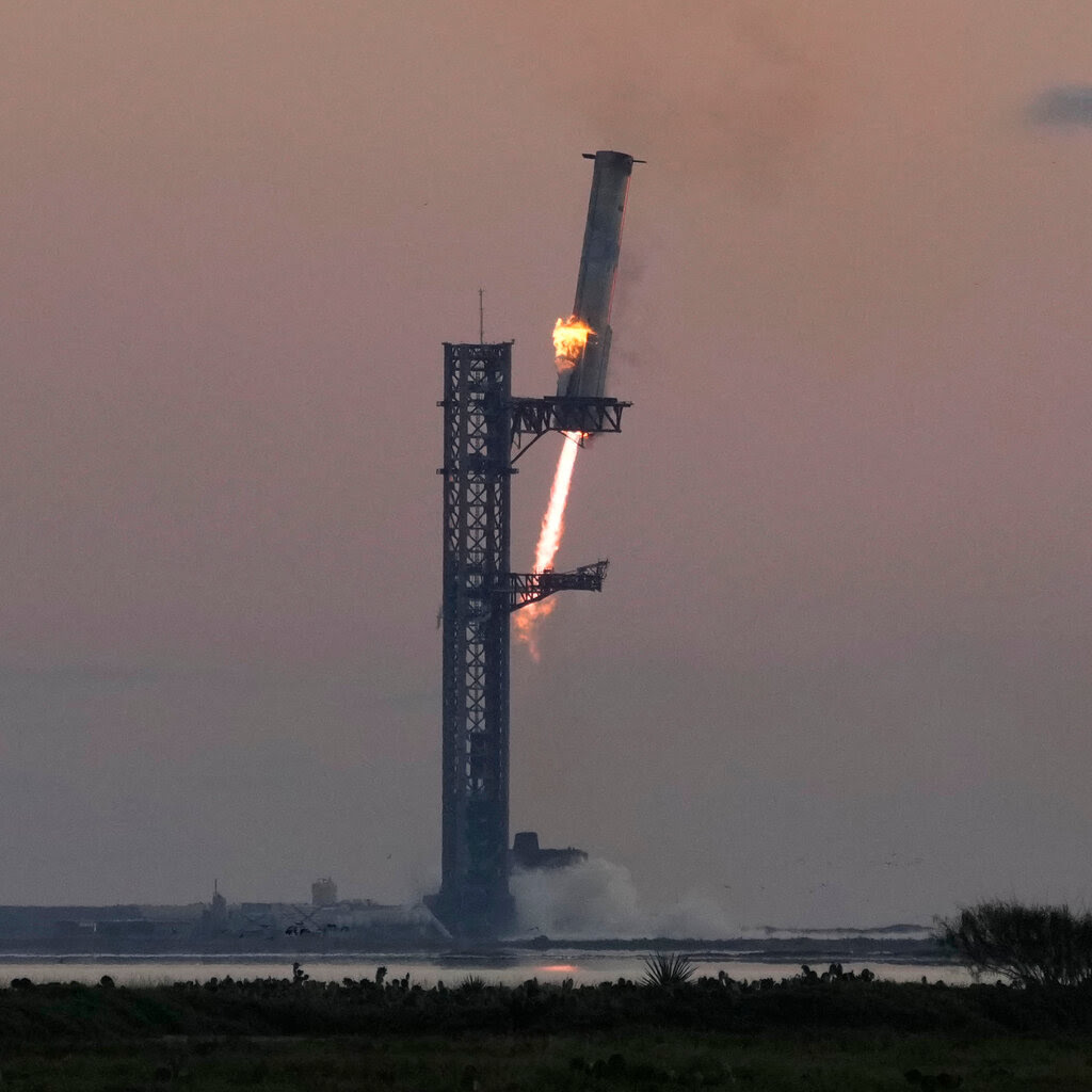 A rocket booster at a launch pad.