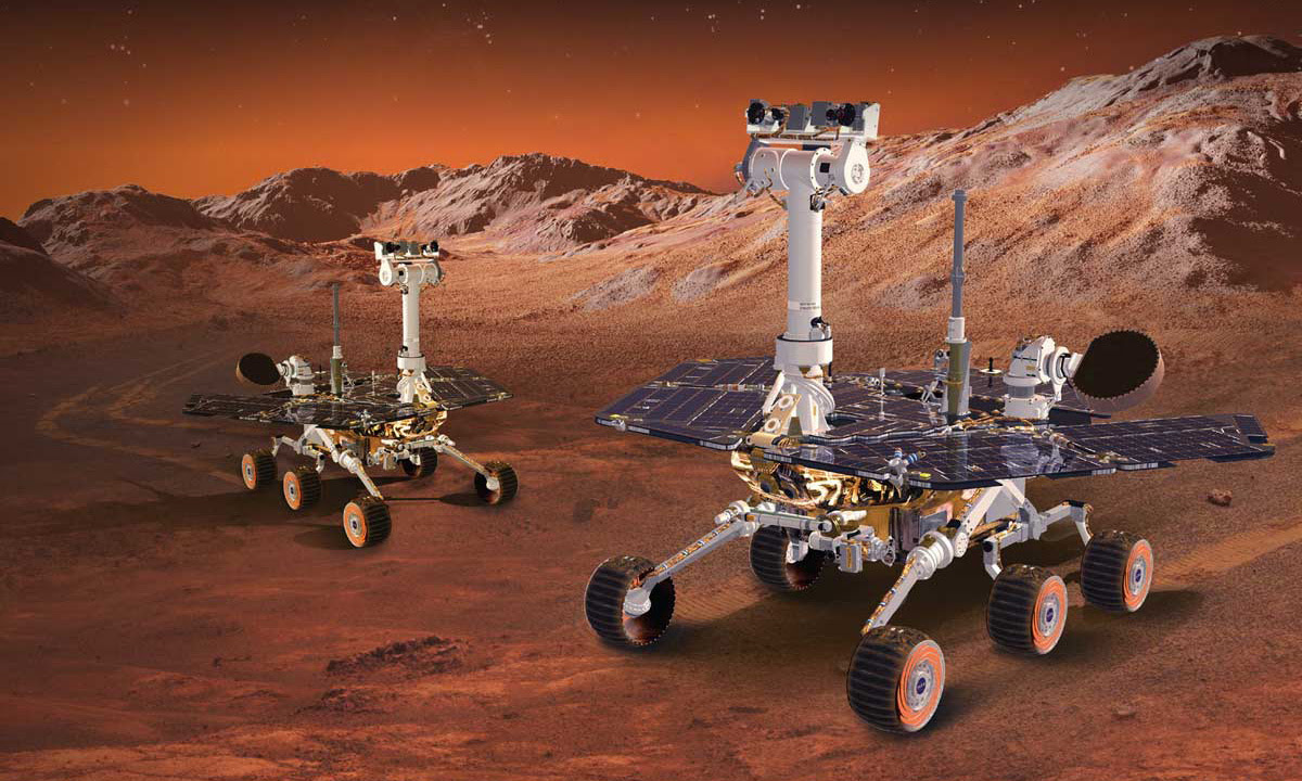 Realistic concept art of twin rovers on the surface of Mars. One is in the foreground and the other is in the background.
