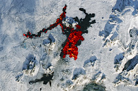 Lava flowing over snow near Grindavik, Iceland.