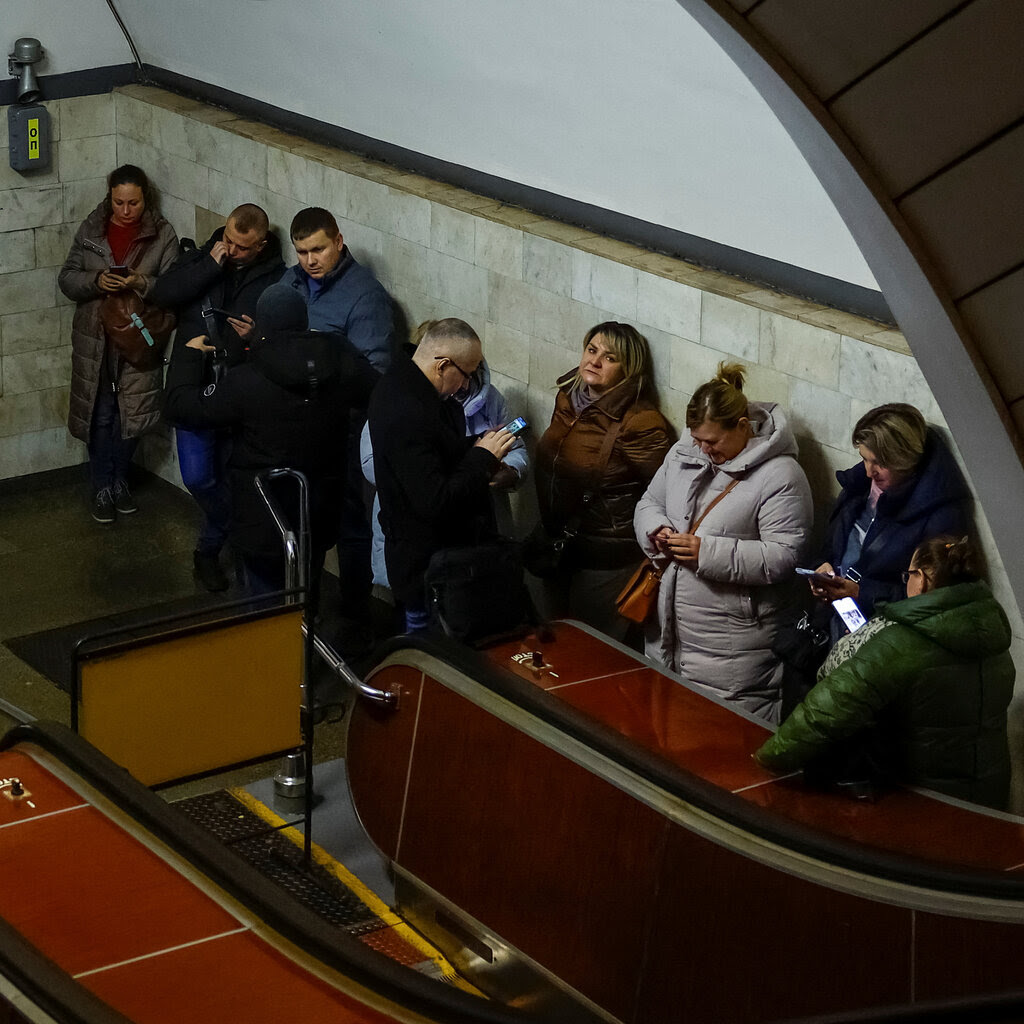 People sheltering inside a metro station during a Russian missile attack in Ukraine.