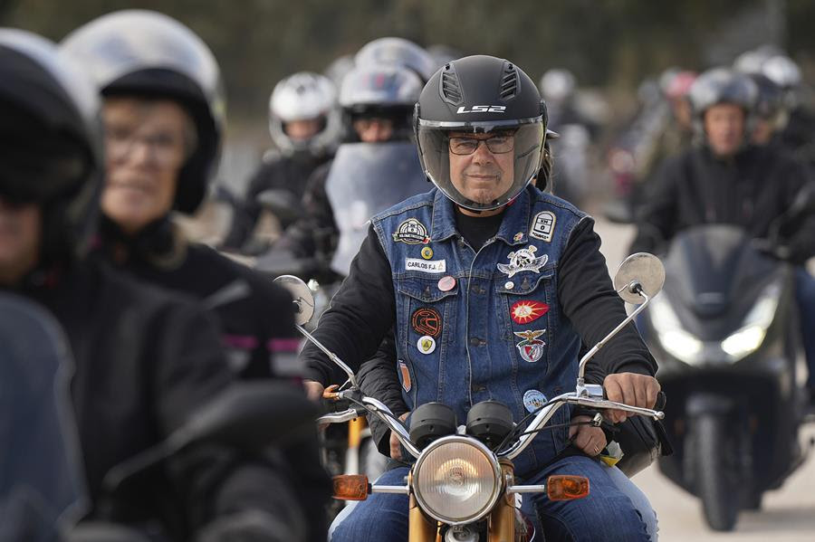 A line of motorcyclists.