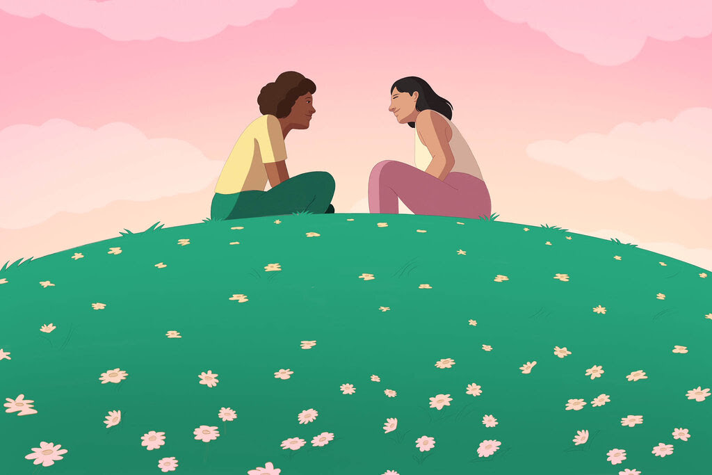 An illustration of two people sitting and facing one another on a grassy field. They are engaged in a conversation. The sky is pink and orange. 