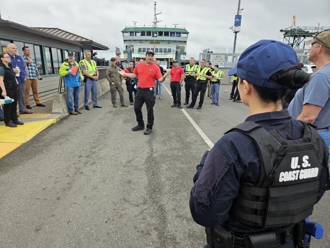 Several people gathered for a discussion at Port Townsend terminal