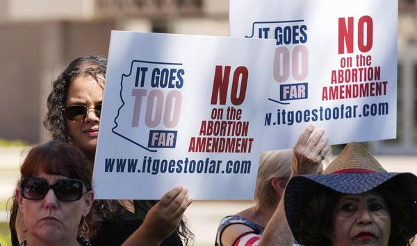 Pro-life activists gather for a news conference after Arizona pro-abortion supporters delivered more than 800,000 petition signatures to the state Capitol to get an abortion initiative on the November general election ballot, July 3, 2024, in Phoenix. (AP Photo/Ross D. Franklin, File)