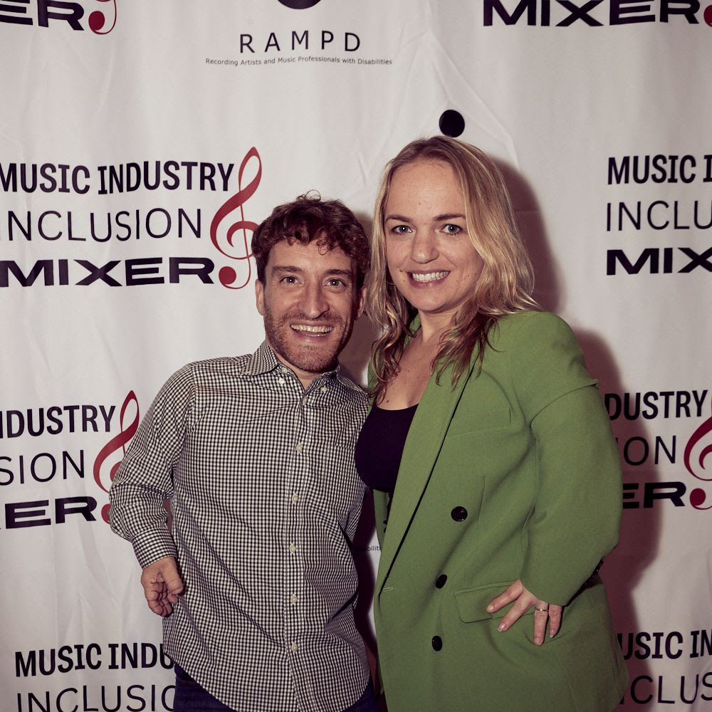 nic novicki and wife in front of rampd step and repeat