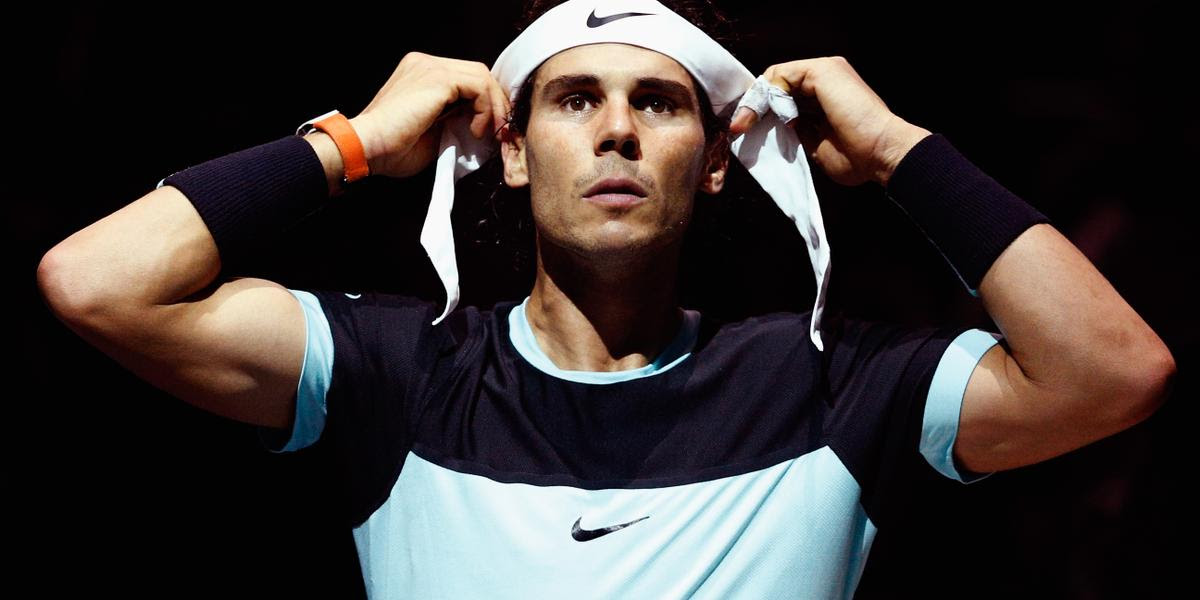 PARIS, FRANCE - NOVEMBER 05: Rafael Nadal of Spain adjusts his headband between games in his match against Kevin Anderson of South Africa during Day 4 of the BNP Paribas Masters held at AccorHotels Arena on November 5, 2015 in Paris, France. (Photo by Dean Mouhtaropoulos/Getty Images)