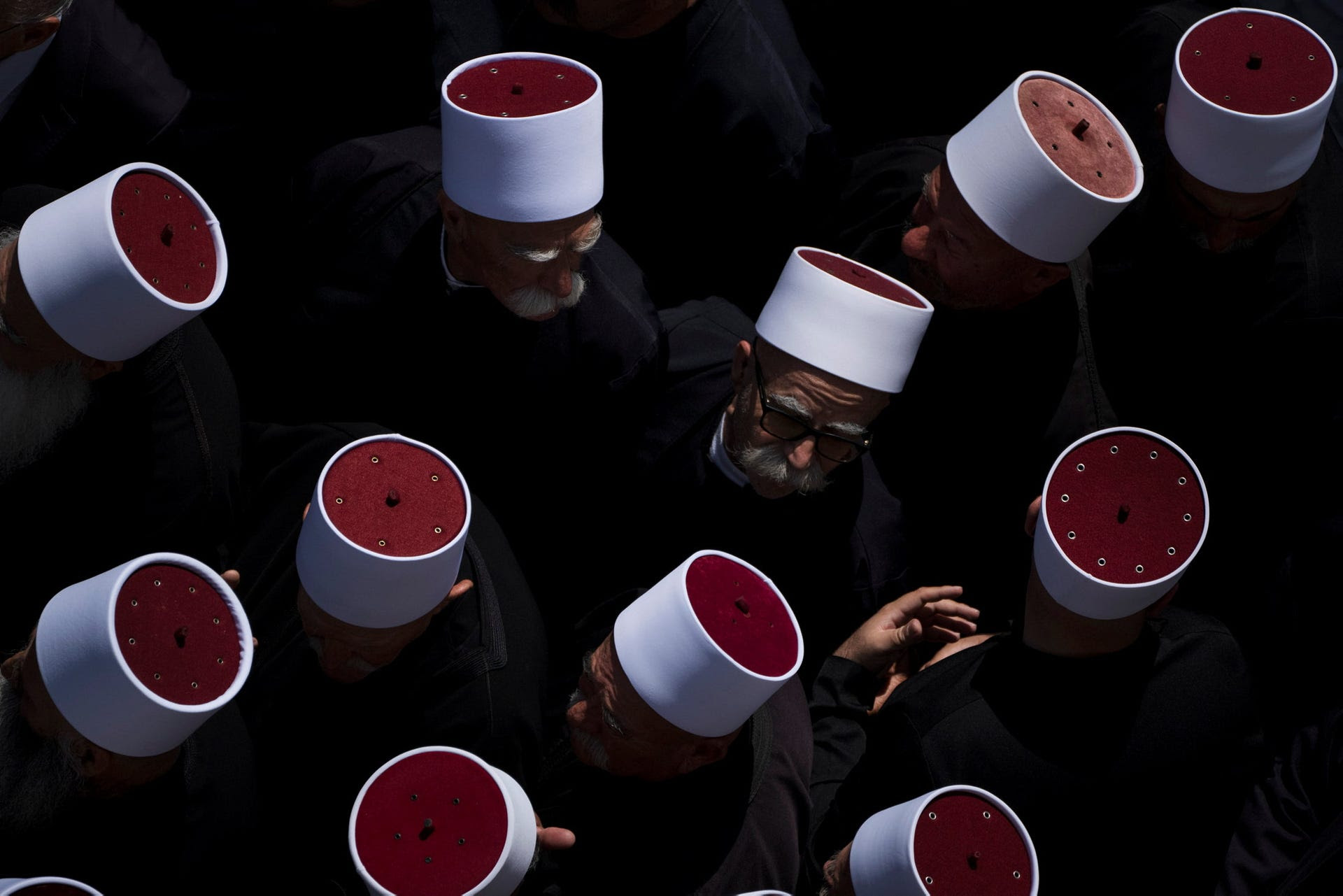 Druze clergymen attend the funeral of the 11 children and teens killed in a rocket strike at a soccer field at the village of Majdal Shams, in the Golan Heights, Sunday.