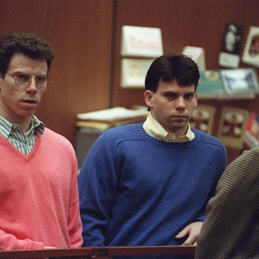 (FILES) Erik Menendez (L) and his brother Lyle (R) listen during a pre-trial hearing, on December 29, 1992 in Los Angeles after the two pleaded innocent in the August 1989 shotgun deaths of their wealthy parents, Jose and Mary Louise Menendez of Beverly Hills, California. Lyle and Erik Menendez, the two brothers whose grisly murder of their parents in their swanky Beverly Hills home gripped the United States and was the subject of a recent Netflix series, could be released from prison after Los Angeles' chief prosecutor said October 24 he would ask a judge to look again at their sentences. (Photo by VINCE BUCCI / GETTY IMAGES NORTH AMERICA / AFP)