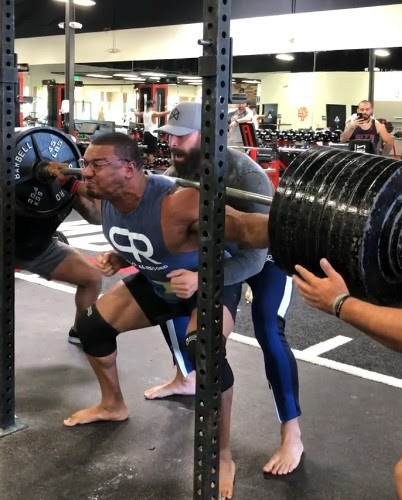 Larry Wheels while squatting 900 lbs