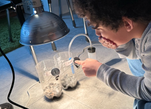 student working on a science experiment