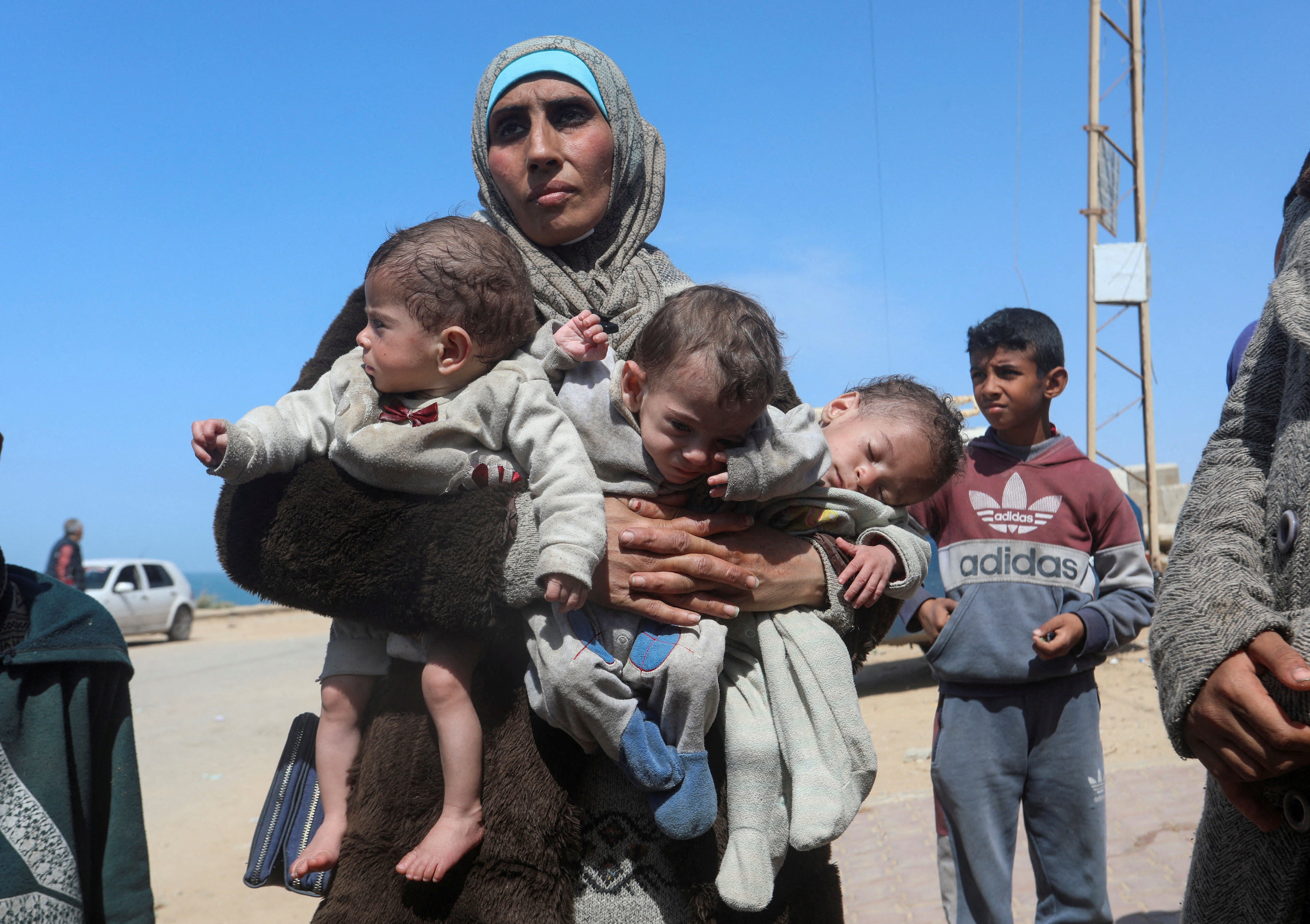 Palestinians fleeing north Gaza after Israeli troops raided Al Shifa hospital, move southward, in the central Gaza Strip