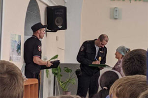 Police are asking church members questions and taking notes.