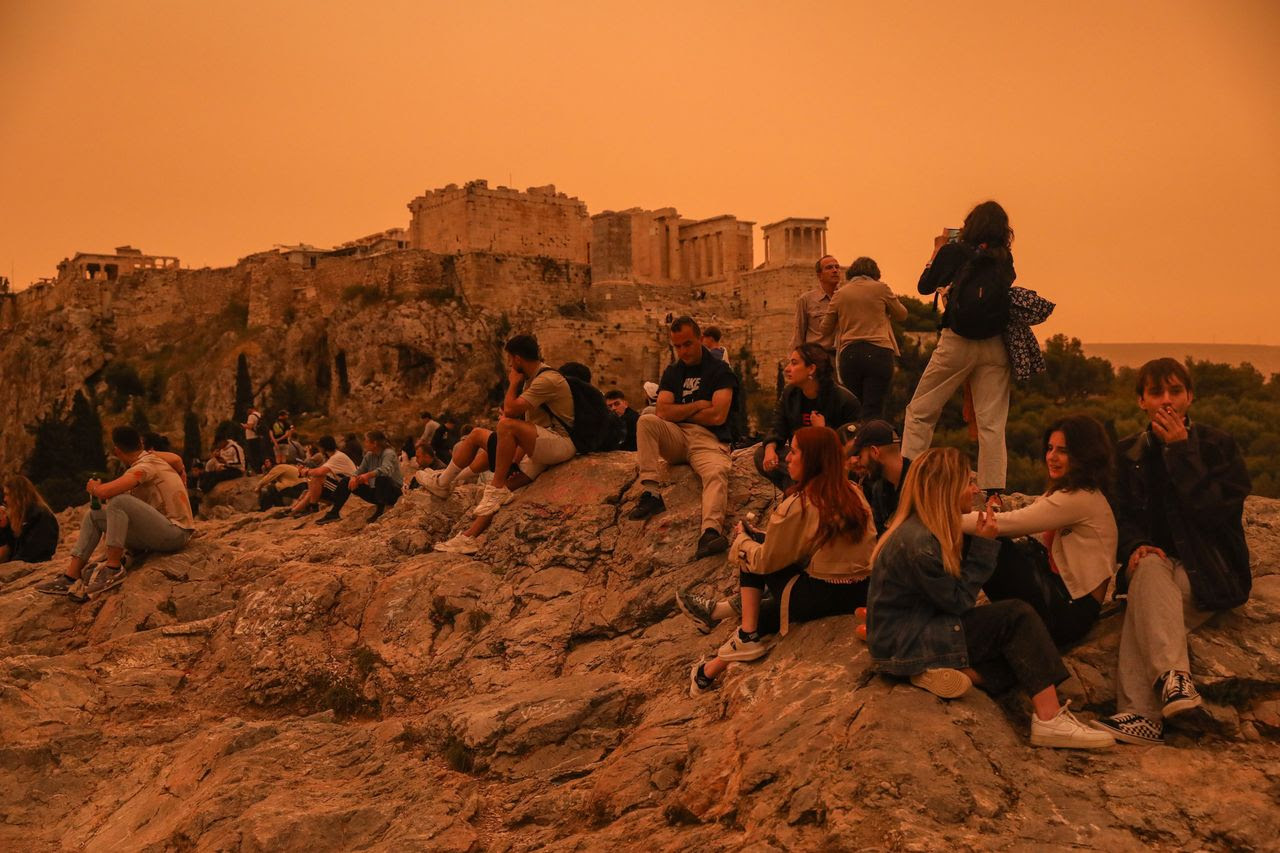 People stroll around the Acropolis. (George Vistaras/EPA-EFE/Shutterstock)&nbsp;
