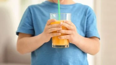 Boy Drinking Orange Juice