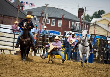 A group of people riding horsesDescription automatically generated