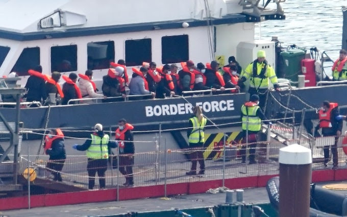 A group of people thought to be migrants are brought in to Dover, Kent, on Monday