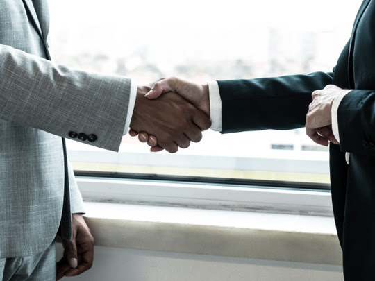 Business handshake - 123RF 