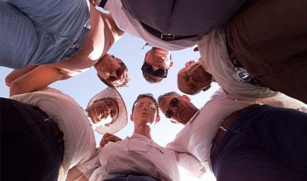 Promise Keepers participants from Eagle Lake, Fla. huddle in prayer during the rally on the Mall in Washington on Saturday, Oct. 4, 1997. In a soul-searching quest for spiritual renewal, hundreds of thousands of Christian men prayed and sang among the great monuments of Washington, eager to own up to their failings and halt a nation&#x27;s moral decline. (AP Photo/Greg Gibson) **FILE**