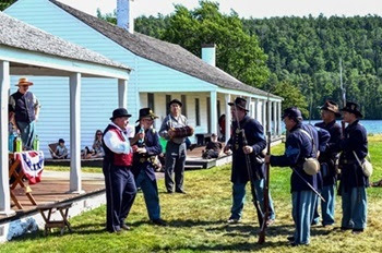 Battery D 1st Michigan Light Artillery reenactors demonstrate 1800s military life and a medicine show at Fort Wilkins Historic State Park