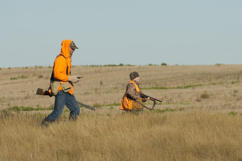 Father and son out pheasant hunting in North Dakota