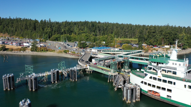 Aerial view of Samish docked at Anacortes terminal with vehicles disembarking the vessel