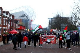 Fans outside Old Trafford with Palestine flags