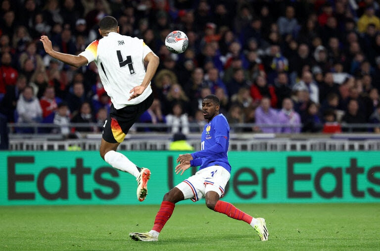 Jonathan Tah, a German player wearing No. 4, in a match against France last month. The team is required to assign the Nos. 4 and 14 in major tournaments. 