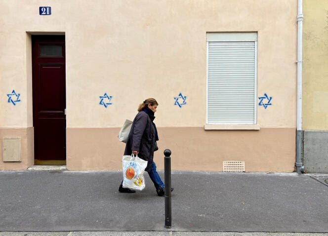 France accuses Russia of 'online interference' over Star of David graffiti  in Paris